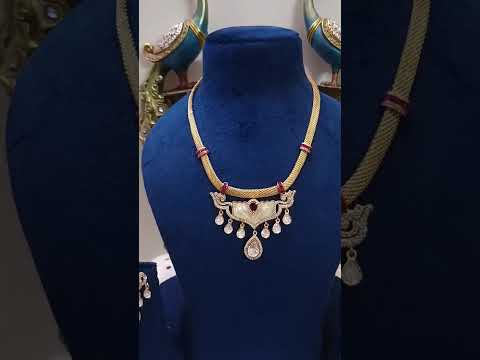 Real-Look-Pendant-Set-With-Mother-Pearl-Ruby-Tyaani-Kundan